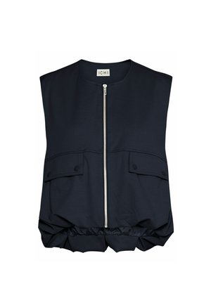 Gilet senza maniche blu navy con chiusura a zip, due tasche frontali con pattina e orlo arricciato in elastico. Realizzato in tessuto morbido e testurizzato.