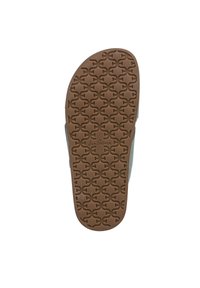 Suola in gomma marrone con un motivo testurizzato caratterizzato da forme intrecciate. Bordo rinforzato e materiale superiore di colore chiaro.
