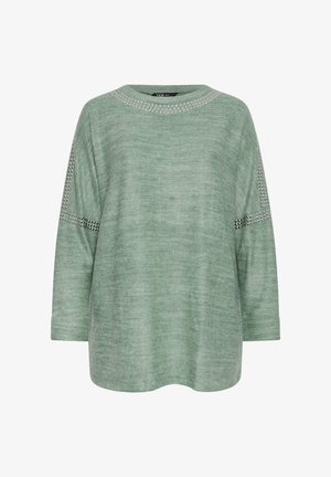 Grüner Langarmtop aus weichem Stoff mit dekorativen Nieten entlang des Ausschnitts und der Ärmel, mit einem lockeren, abgerundeten Saum.
