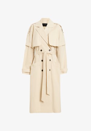Trench coat beige realizzato in materiale leggero, con davanti doppiopetto, colletto oversize e due grandi tasche. Comprende una cintura staccabile.
