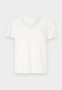 T-shirt blanc à col en V en tissu texturé avec un motif floral, manches courtes et coupe décontractée. Les bords sont légèrement festonnés.