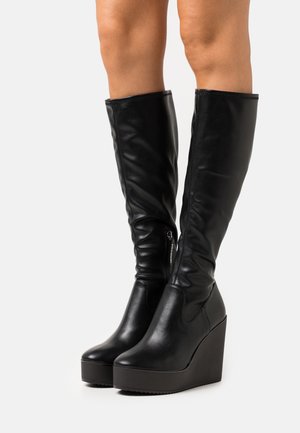 JUSTLY - Keilstiefel - black