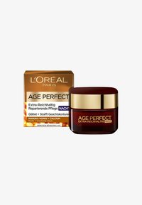 L'Oréal Age Perfect nattkräm i en djup röd glasburk med ett guldlock. Åtföljd av en guldbox med produktinformation i svart och vitt text.