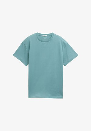 Camiseta de manga corta y cuello redondo en un suave color teal. Está hecha de una mezcla de algodón suave, con un diseño simple y sin adornos.