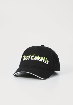Black cap with embroidered "Just Cavalli" logo in white and green. Features a curved brim and white piping along the edge.
