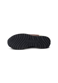 Rubber outsole with a wavy tread pattern and "WODEN" embossed logo. Color is predominantly black with textured surface for traction.