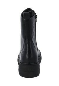 Bottillons en cuir noir avec une texture lisse, dotés d'une fermeture éclair latérale, d'un bout rond et d'une épaisse semelle en caoutchouc noir.