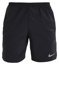 Pantalones cortos deportivos negros con cintura elástica, fabricados en material ligero. Presentan un pequeño logo reflectante de Nike en la parte inferior derecha.