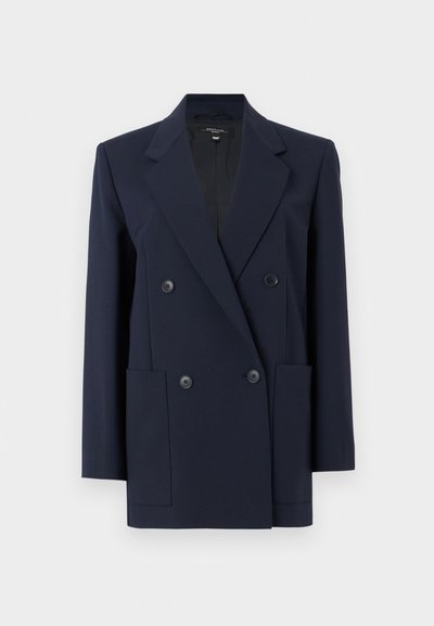 Μπλε ναυτικό, διπλό στήθος σακάκι με γιακάδες notch, τέσσερα κουμπιά μπροστά, μακριά μανίκι α και δύο εμπρόσθιες εξωτερικές τσέπες.