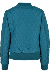 Quiltad bomberjacka i teal, med ribbad krage och muddar, med en slät textur och diamantmönster genom hela plagg.