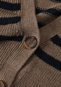 Knitted cardigan in brown with navy stripes, featuring a large, round, tortoiseshell button. Texture appears soft and woven.