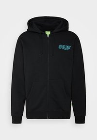 Felpa nera con zip realizzata in tessuto misto cotone, con logo "HUF" turchese sul lato sinistro del petto, due tasche frontali e polsini a costine.