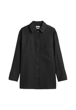 Camicia nera in lino con chiusura a bottoni, maniche lunghe e una singola tasca sul petto. Presenta un colletto classico e una silhouette rilassata.