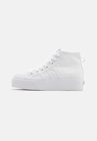 White high-top sneaker with laces, three stitched stripes on the side, a textured rubber sole, and a pull tab at the heel.