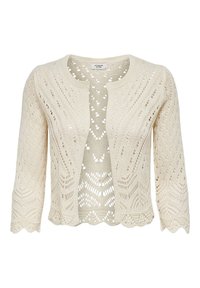 Knit cardigan in beige, featuring a scalloped hem, open front, and intricate lace patterns throughout the fabric. Three-quarter length sleeves.