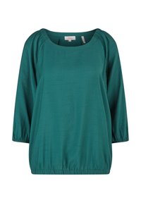 Blouse à manches longues vert sarcelle avec poignets et ourlet élastiqués froncés, encolure ronde et motif subtil en tissu texturé.