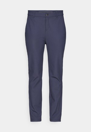 Marineblå bukser laget av elastisk stoff med en glatt tekstur, med en standard midje med knappelukking og avsmalnende ben.