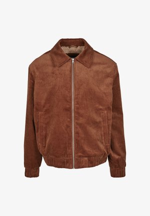 Brown corduroy jacket with a collared neck, front zipper closure, and two side pockets. Ribbed texture and cuffs, casual fit.