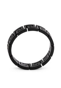 Black elastic bracelet with interlocking geometric links featuring a wave pattern. Smooth finish with a matte texture. Circular shape.