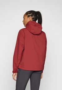 Red hooded jacket with a smooth texture, featuring a relaxed fit and adjustable cuffs. Back view shows a clean design without embellishments.