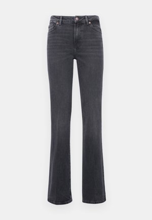 Pelēki izplešamie džinsi, izgatavoti no denima, ar nelielu izbalējumu. Tiem ir pogu aizdare, piecas kabatas un redzama dūrezīgā šuvšana garām šuvēm.