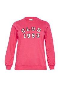Vaaleanpunainen collegepaita, jossa on pitkät hihat, pyöreä kaula-aukko ja "CLUB 1993" -teksti mustana ja valkoisena edessä. Pehmeää materiaalia ja ribbikudotut hihansuut.
