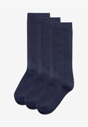 Chaussettes bleu marine foncé en pack de trois, arborant un motif en losanges texturé et une bordure côtelée, fabriquées en tissu doux et durable.
