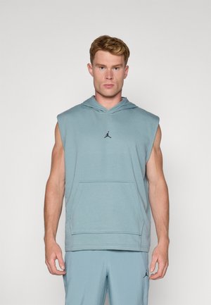 Sleeveless hoodie in light blue fabric. Features a kangaroo pocket and a black logo at the chest. Simple, unembellished design.