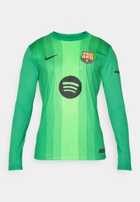 Maglia da portiere a maniche lunghe verde con strisce verticali, con logo Spotify nero e stemma del FC Barcelona sul petto. Marchio Nike sulla manica.