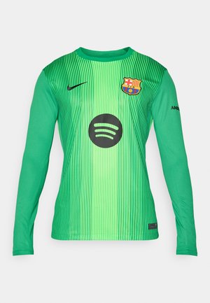 Green long-sleeve goalkeeper jersey with vertical stripes, featuring a black Spotify logo and FC Barcelona crest on the chest. Nike branding on sleeve.