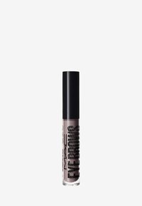 Gel à sourcils MAC dans un tube transparent, avec un capuchon noir et un texte en gras. La formule liquide apparaît dans une teinte taupe clair avec une texture lisse.