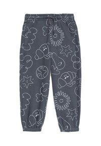 Graue Baumwoll-Sweatpants mit weißen cartoonartigen Zeichnungen von lächelnden Gesichtern, Sternen und Wolken. Elastischer Bund und Bündchen.