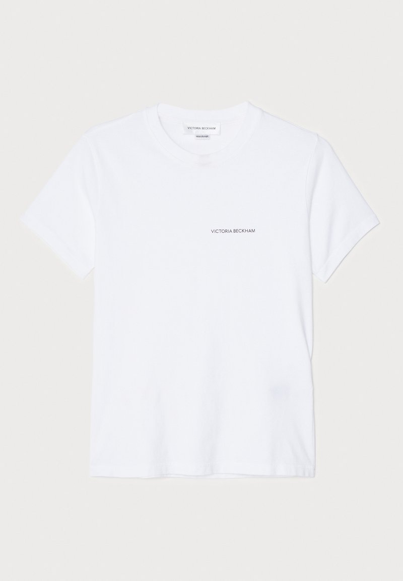 Camiseta blanca de algodón con mangas cortas, cuello redondo y un pequeño logo negro "VICTORIA BECKHAM" en el pecho. Diseño minimalista.