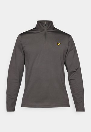 Grå långärmad tröja med halvdragkedja, med en gul fågel-logotyp på vänster bröstområde och ett mjukt, texturerat tyg.