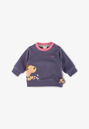Lila Sweatshirt mit pinkem Hals- und Ärmelbund, mit einem lächelnden Hundegrafik auf der Vorderseite und floralen Details. Inklusive eines dekorativen Anhängers.
