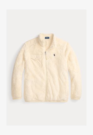 Cream-colored fleece jacket with zip front, high collar, side pockets, and a small logo on the chest. Soft, textured fabric.