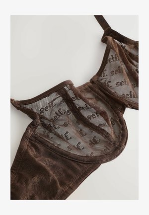 Brown mesh bra with semi-transparent fabric, featuring a subtle repeating text pattern and adjustable straps. The design emphasizes a structured shape.
