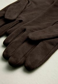 Brown, soft fabric gloves with five distinct fingers, featuring a smooth texture and simple design without any visible embellishments.
