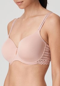 Różowy biustonosz z drutem, wykonany z gładkiego materiału, z koronkowymi akcentami po bokach, regulowanymi, podwójnymi ramiączkami oraz zamek błyskawiczny z przodu.