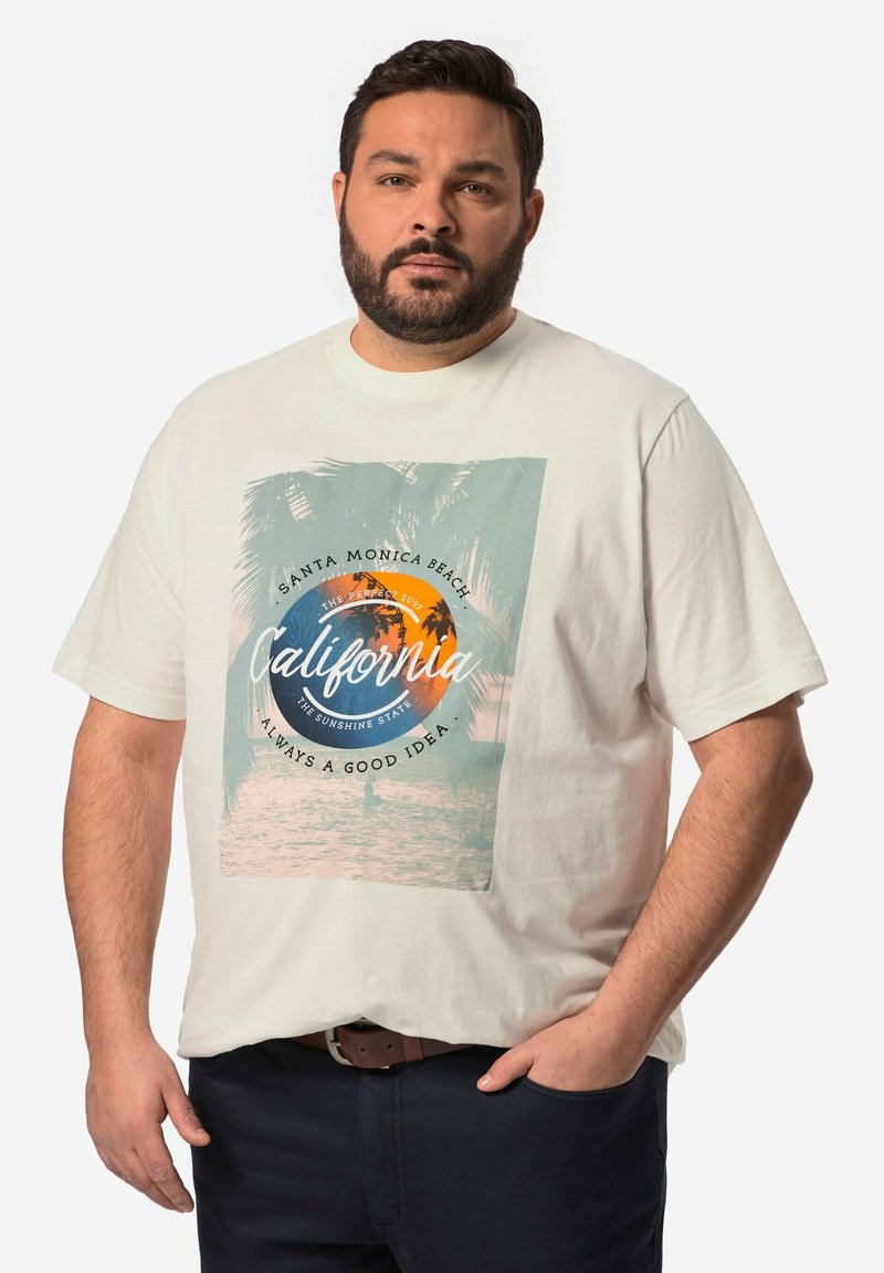Camiseta de algodón color crema con un estampado gráfico de palmeras, un sol naranja y texto sobre California, en un diseño de corte relajado.