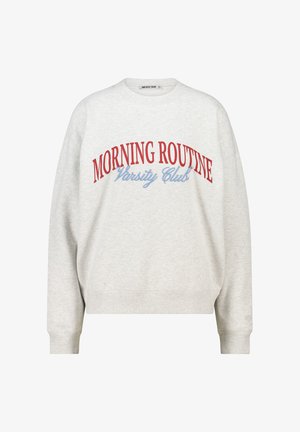 Light gray sweatshirt with a crew neckline and long sleeves. Features red and blue text reading "MORNING ROUTINE Varsity Club." Soft fabric.