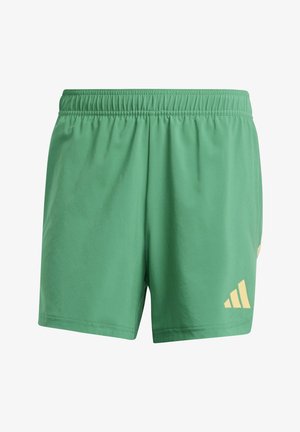 Green athletic shorts made of soft fabric with an elastic waistband. Features a yellow Adidas logo on the lower right side.