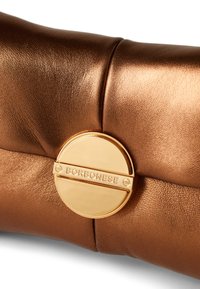 Copper-colored leather bag with a smooth, textured surface and a round gold hardware logo featuring the brand name "Borbonesse."