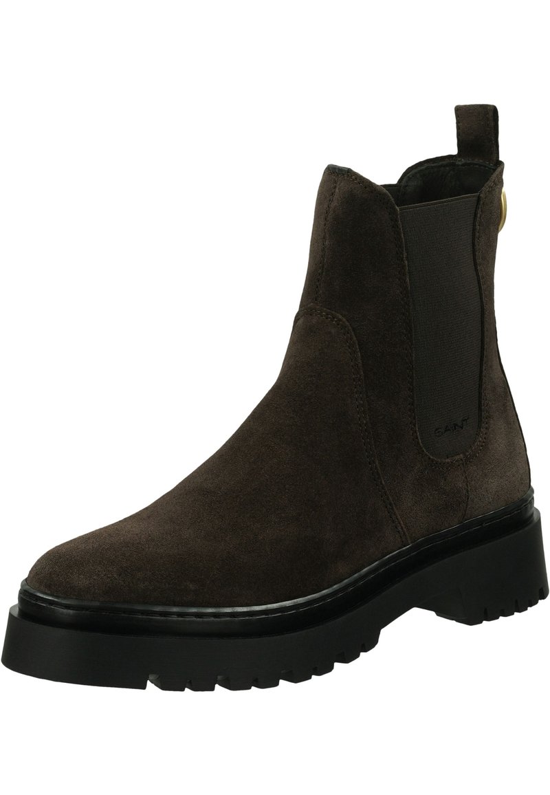 Braune Wildleder-Stiefeletten mit seitlichen Gummizügen, einer Zuglasche und einer robusten schwarzen Gummi-Sohle mit einem strukturierten Profil.