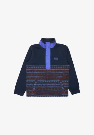 Fleece pullover met hoge kraag, marineblauwe bovenkant en een gemusterd bruine en blauwe onderkant. Voorzien van een drukknoopsluiting en zijzakken.