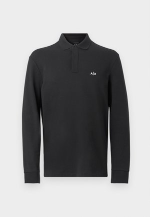 Black long-sleeve polo shirt made of cotton, featuring a collared neck and a small white logo on the left chest area. Smooth texture.