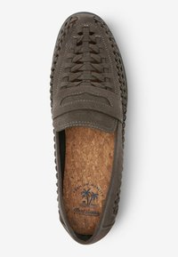Gray suede loafers with woven detailing, cork insole, and decorative stitching. Smooth texture with a flexible sole, featuring palm tree graphic inside.