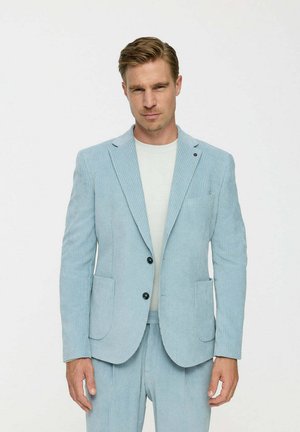 Light blue corduroy blazer with notch lapels, two front pockets, and black buttons. Worn over a plain white t-shirt.