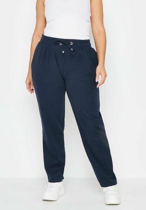 Navy blauwe joggers van zachte stof, met een elastische taille met trekkoord en zijzakken. Recht model met eenvoudige stiksels.