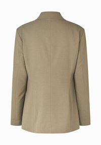 Beige skräddarsydd blazer med slagkrage och långa ärmar. Slät tyg, välarbetad passform och diskreta sömdetaljer på baksidan.
